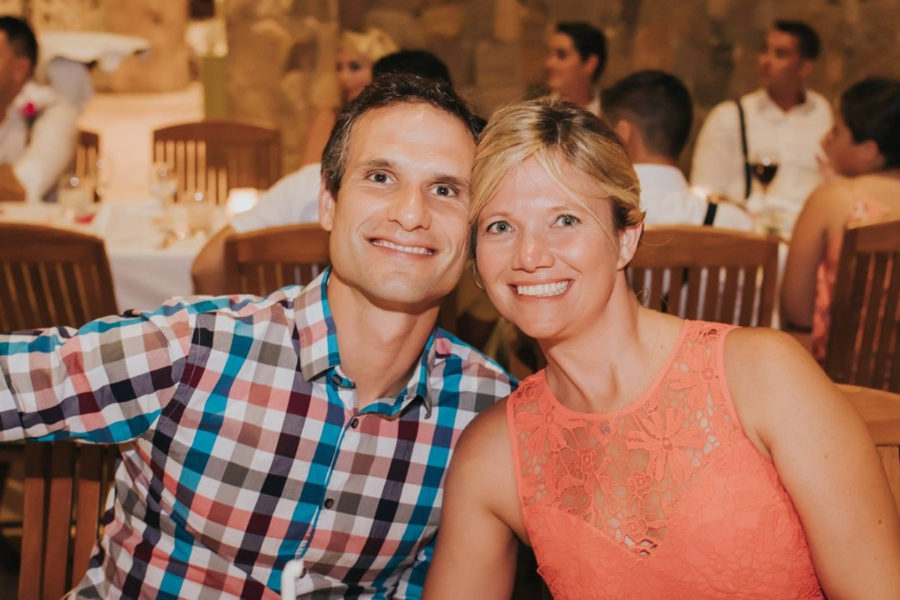 Steve and JaNette smile at a wedding